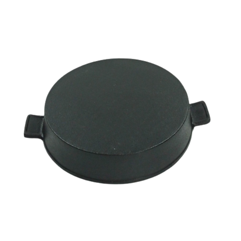 Poêle à griller ronde en fonte noire avec marques de saisie et de gril